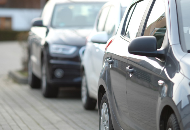 A line of cars parked near a station, symbolizing efficient car maintenance services for commuters in Hildenborough.